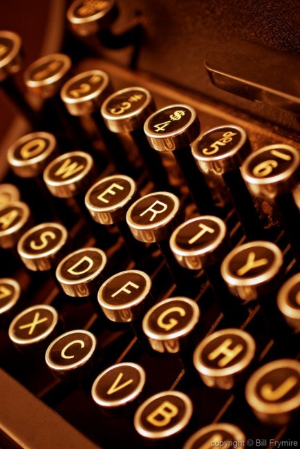 antiquated;antique;Bill Frymire;brown;business;close-up view;communication;glow;keys;letters;manual;numbers;old;old-fashioned;orange;reliable;tried and true;trusted;trusty;typewriter;vertical;