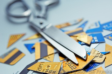 scissors on top of cut up credit cards