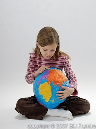 child holding earth