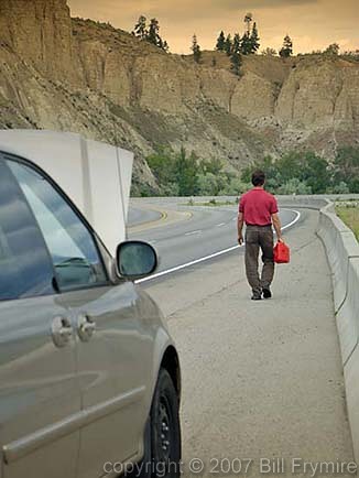 man walking for gas on highway