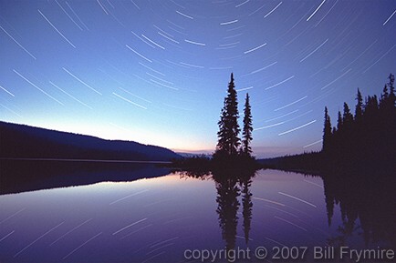 star trails over lake