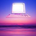 computer over ocean sunrise