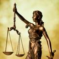 Statue of Lady Justice Holding Scales of Justice 