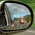 transport truck in side view mirror