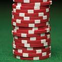 stack of red poker chips green felt